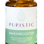 Nahaufnahme von Puristic Immunbooster im braunen Glas zur Stärkung des Immunsystems